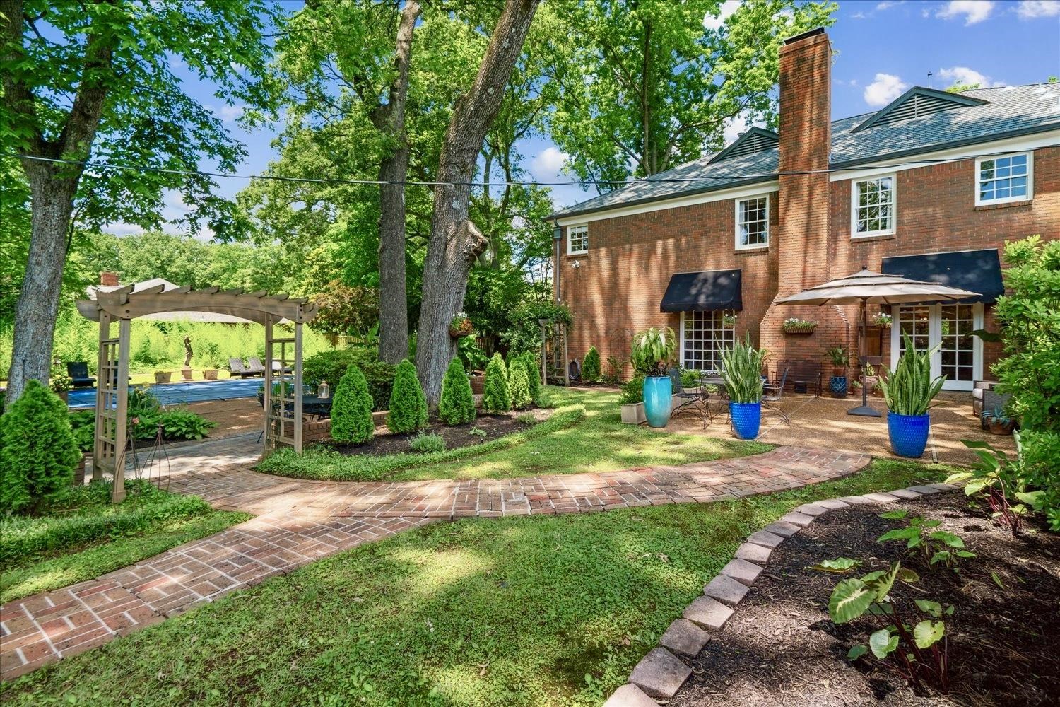 4585 Walnut Grove Road Memphis, TN 38117 - Photo 30 of 36 a view of a house with a yard patio and tree s