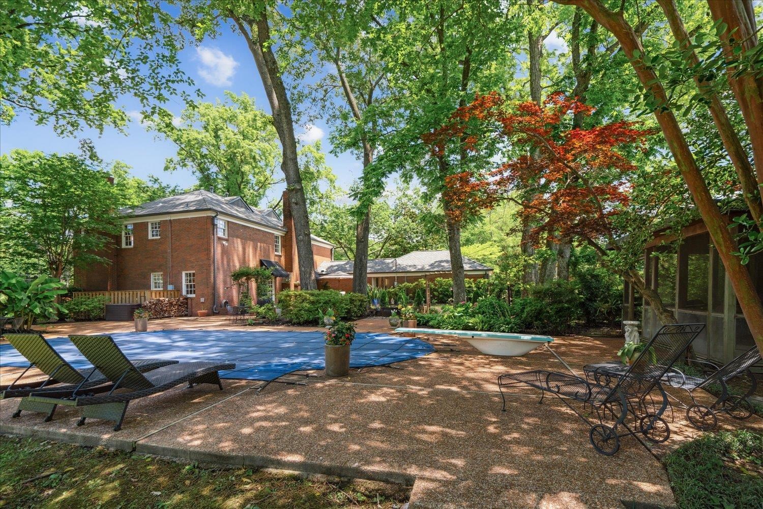 4585 Walnut Grove Road Memphis, TN 38117 - Photo 32 of 36 a backyard of a house with barbeque oven table and chairs