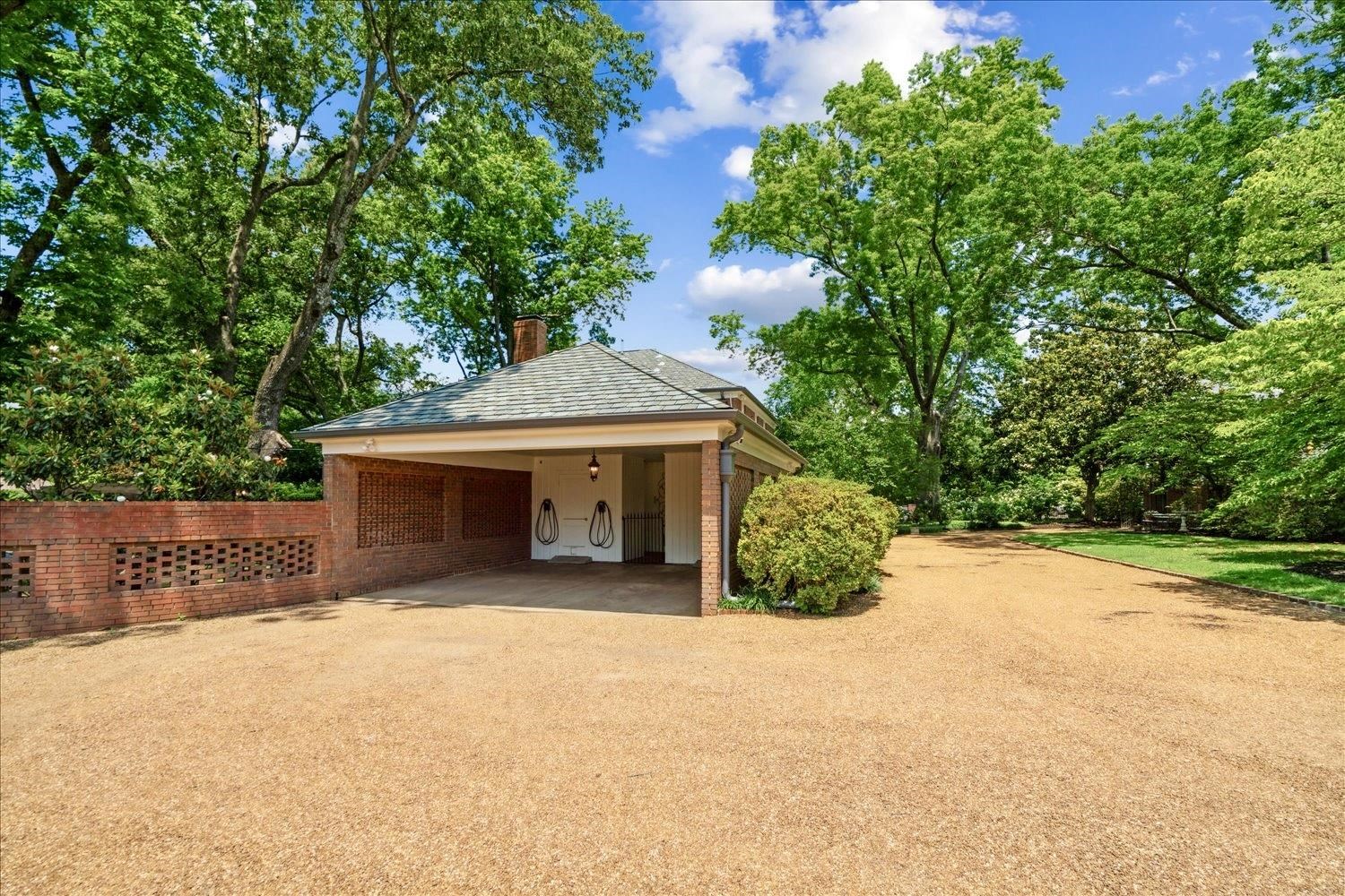 4585 Walnut Grove Road Memphis, TN 38117 - Photo 35 of 36 a front view of a house with a yard