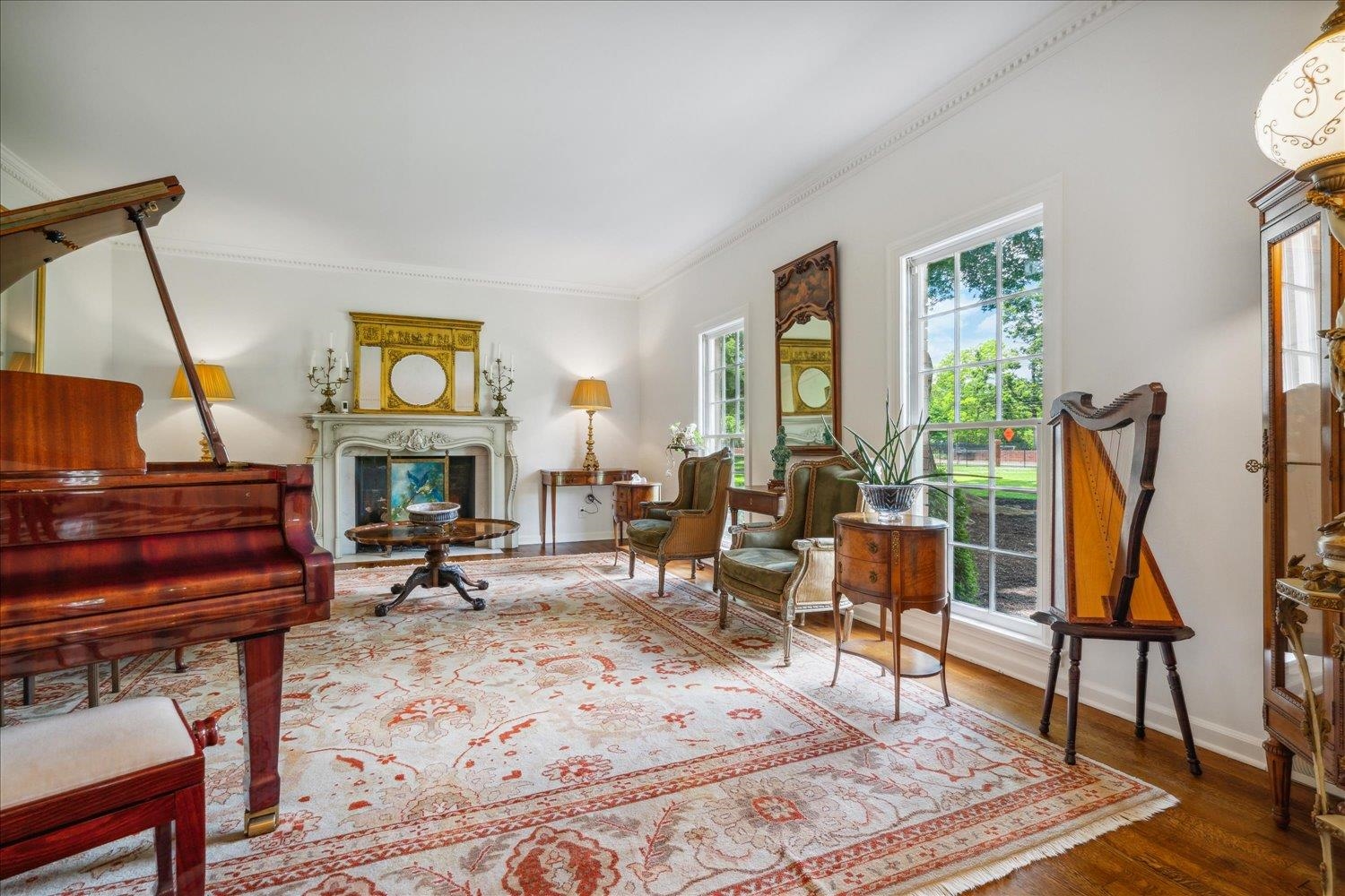 4585 Walnut Grove Road Memphis, TN 38117 - Photo 5 of 36 a living room with furniture a piano and a fireplace