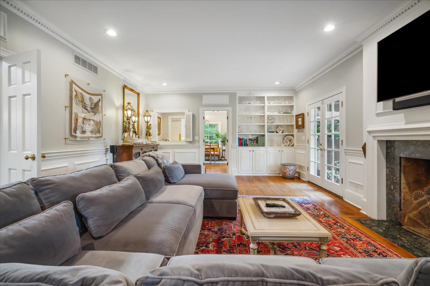 4585 Walnut Grove Road Memphis, TN 38117 - Photo 9 of 36 a living room with furniture and a flat screen tv
