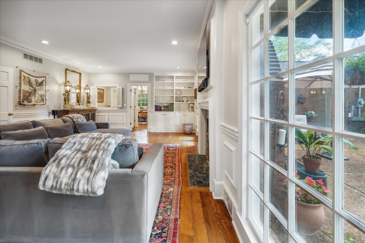 4585 Walnut Grove Road Memphis, TN 38117 - Photo 10 of 36 a living room with furniture fireplace and a large window