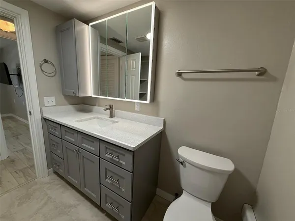 a view of a bathroom from a hallway