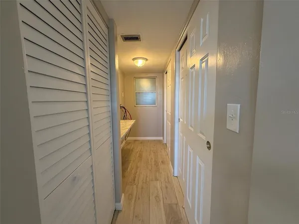a bathroom with a sink and mirror