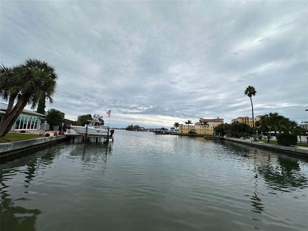 175 55th Avenue, Unit 109 St. Pete Beach, FL 33706 - Photo 26 of 27 a view of ocean view with boat and palm trees