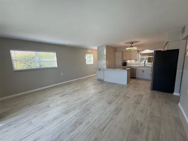a view of a hallway with a flat screen tv