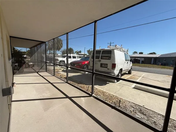 a kitchen with a refrigerator a microwave and cabinets