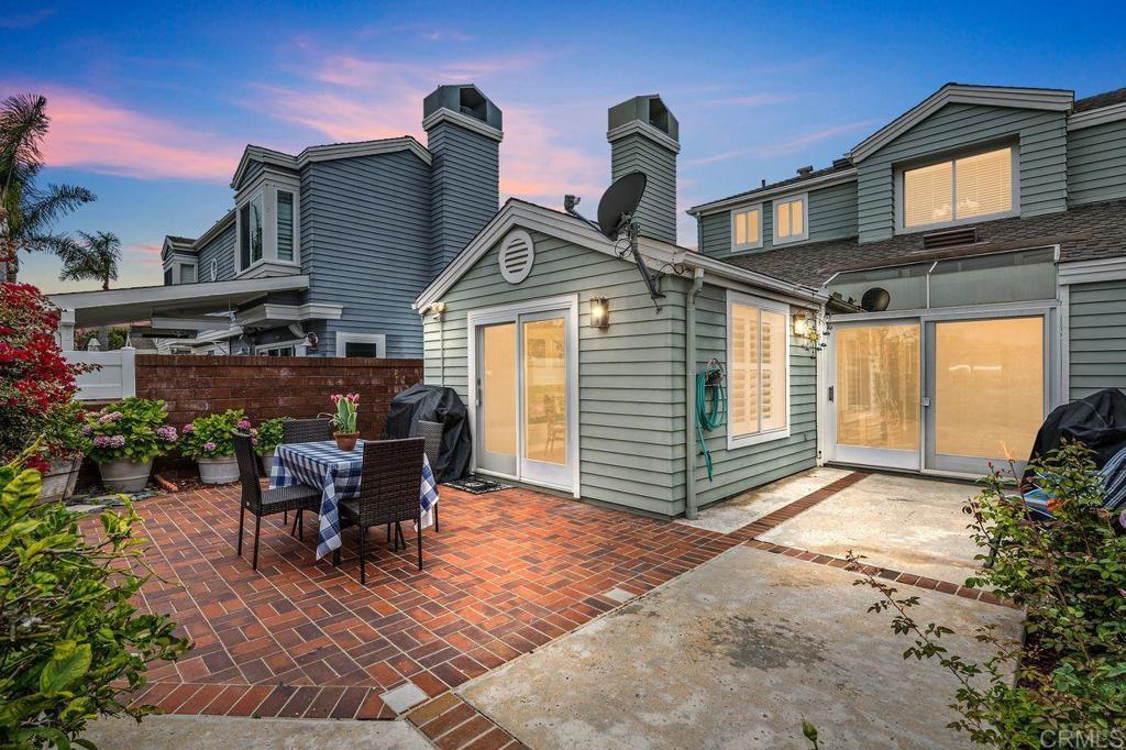 7010 Lantana Terrace Carlsbad, CA 92011 - Photo 20 of 45 a view of a house with backyard and porch
