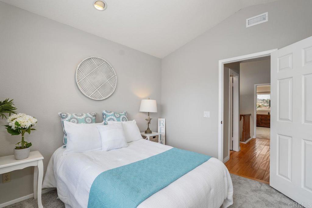 7010 Lantana Terrace Carlsbad, CA 92011 - Photo 29 of 45 a bedroom with bed and window