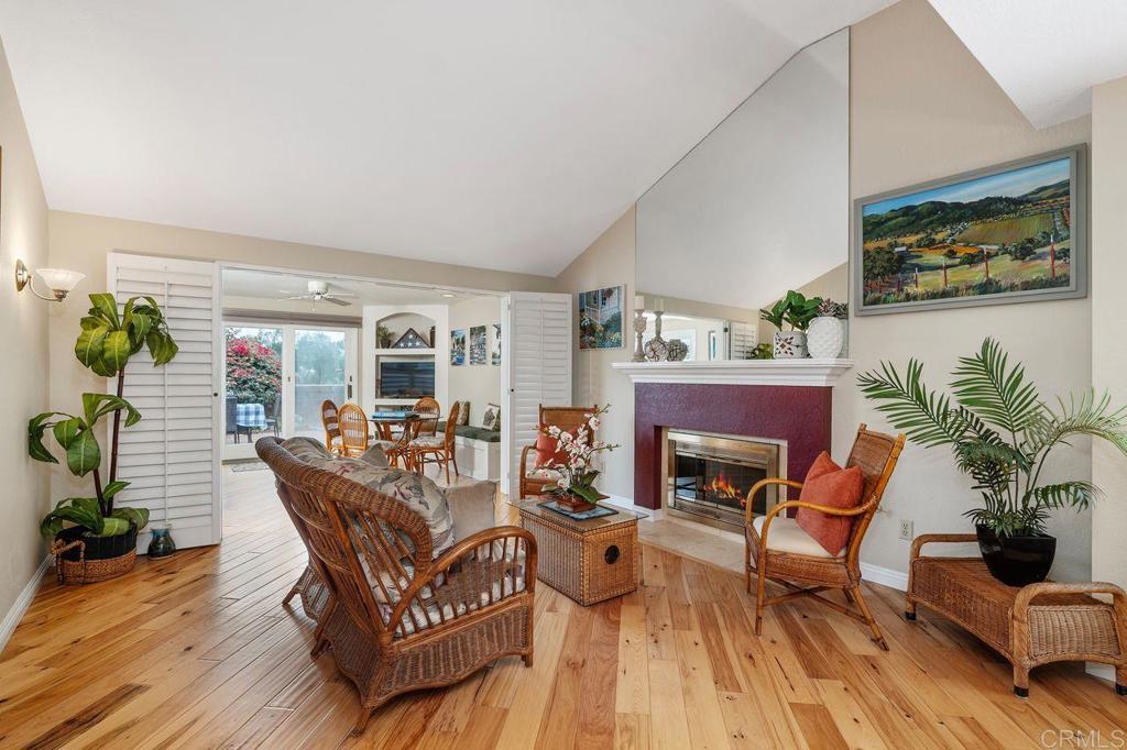 7010 Lantana Terrace Carlsbad, CA 92011 - Photo 3 of 45 a living room with furniture and a fireplace