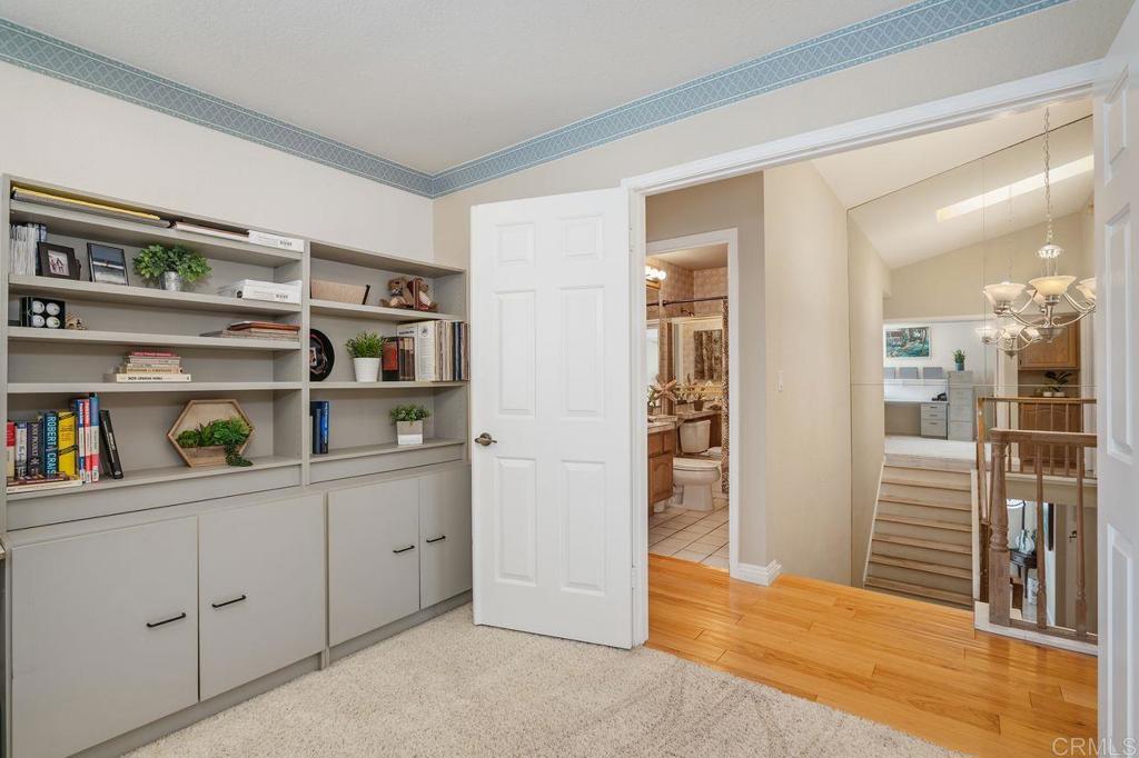 7010 Lantana Terrace Carlsbad, CA 92011 - Photo 31 of 45 a view of kitchen with refrigerator and wooden floor