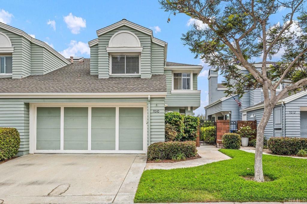 7010 Lantana Terrace Carlsbad, CA 92011 - Photo 34 of 45 a front view of a house with a yard