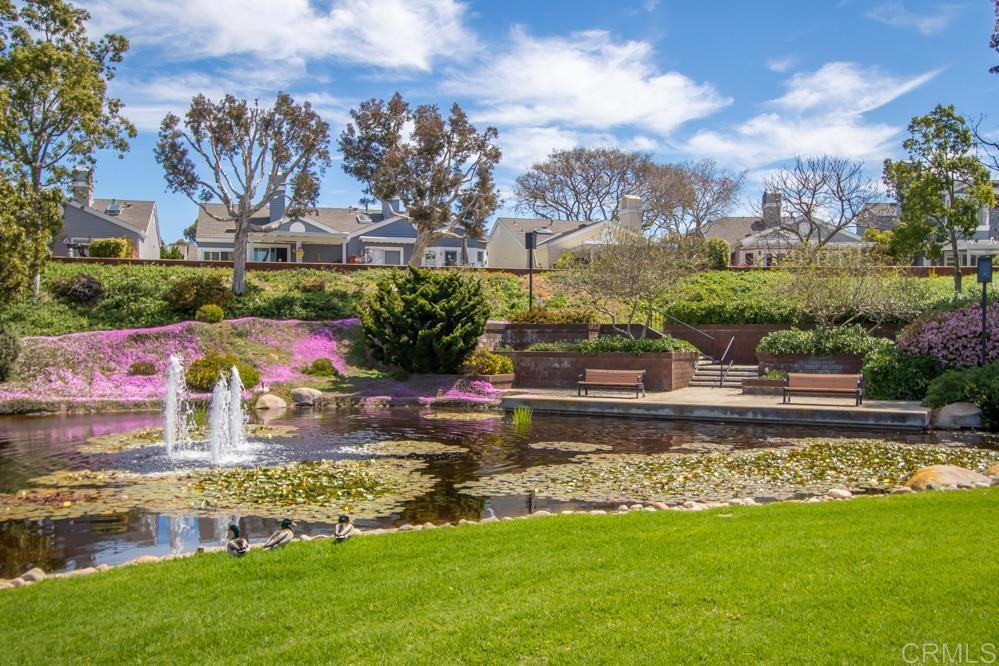 7010 Lantana Terrace Carlsbad, CA 92011 - Photo 38 of 45 a view of a lake with a building in the background