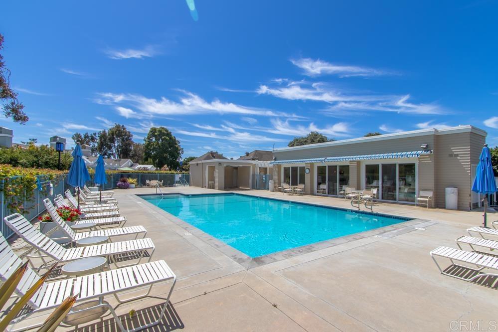 7010 Lantana Terrace Carlsbad, CA 92011 - Photo 39 of 45 a front view of a house with swimming pool having outdoor seating