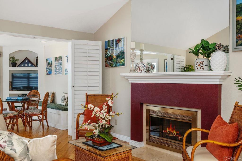7010 Lantana Terrace Carlsbad, CA 92011 - Photo 4 of 45 a living room with furniture and a fireplace