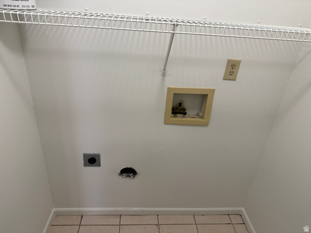 747 Hanover Drive Orem, UT 84058 - Photo 12 of 30 Laundry room with washer hookup, light tile patterned floors, and electric dryer hookup