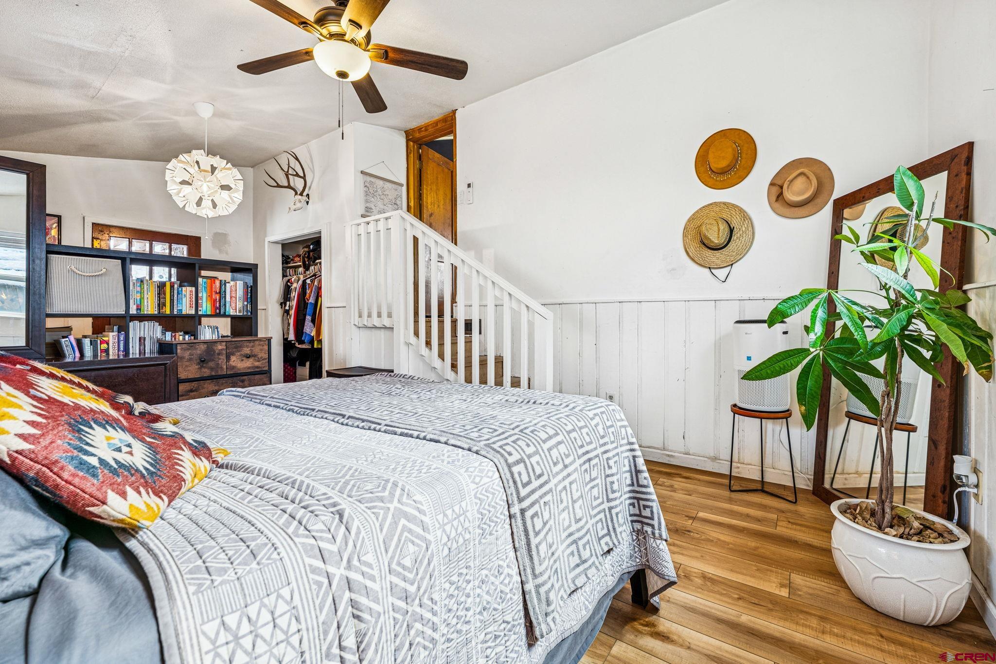 476 East 5th Street Durango, CO 81301 - Photo 14 of 40 a bedroom with a bed and a chandelier