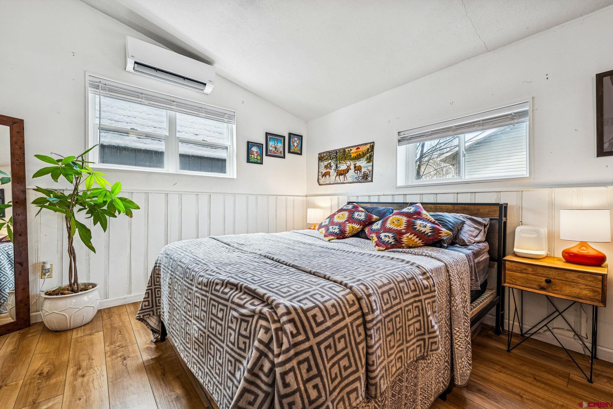 476 East 5th Street Durango, CO 81301 - Photo 15 of 40 a bed sitting in a bedroom next to a window