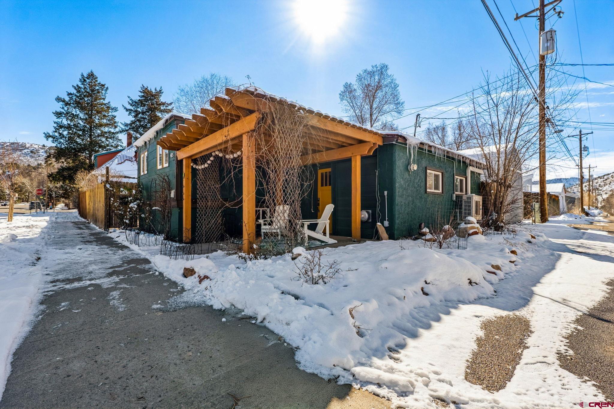 476 East 5th Street Durango, CO 81301 - Photo 21 of 40 a view of a house with a yard covered in snow