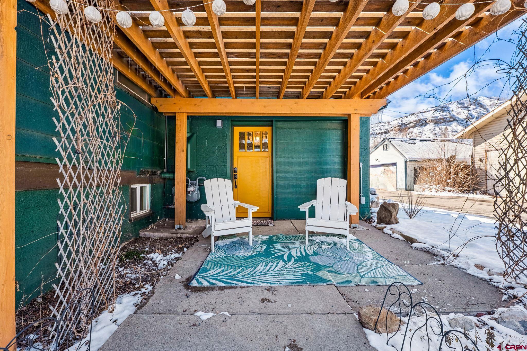 476 East 5th Street Durango, CO 81301 - Photo 23 of 40 a chairs and table in a backyard of the house
