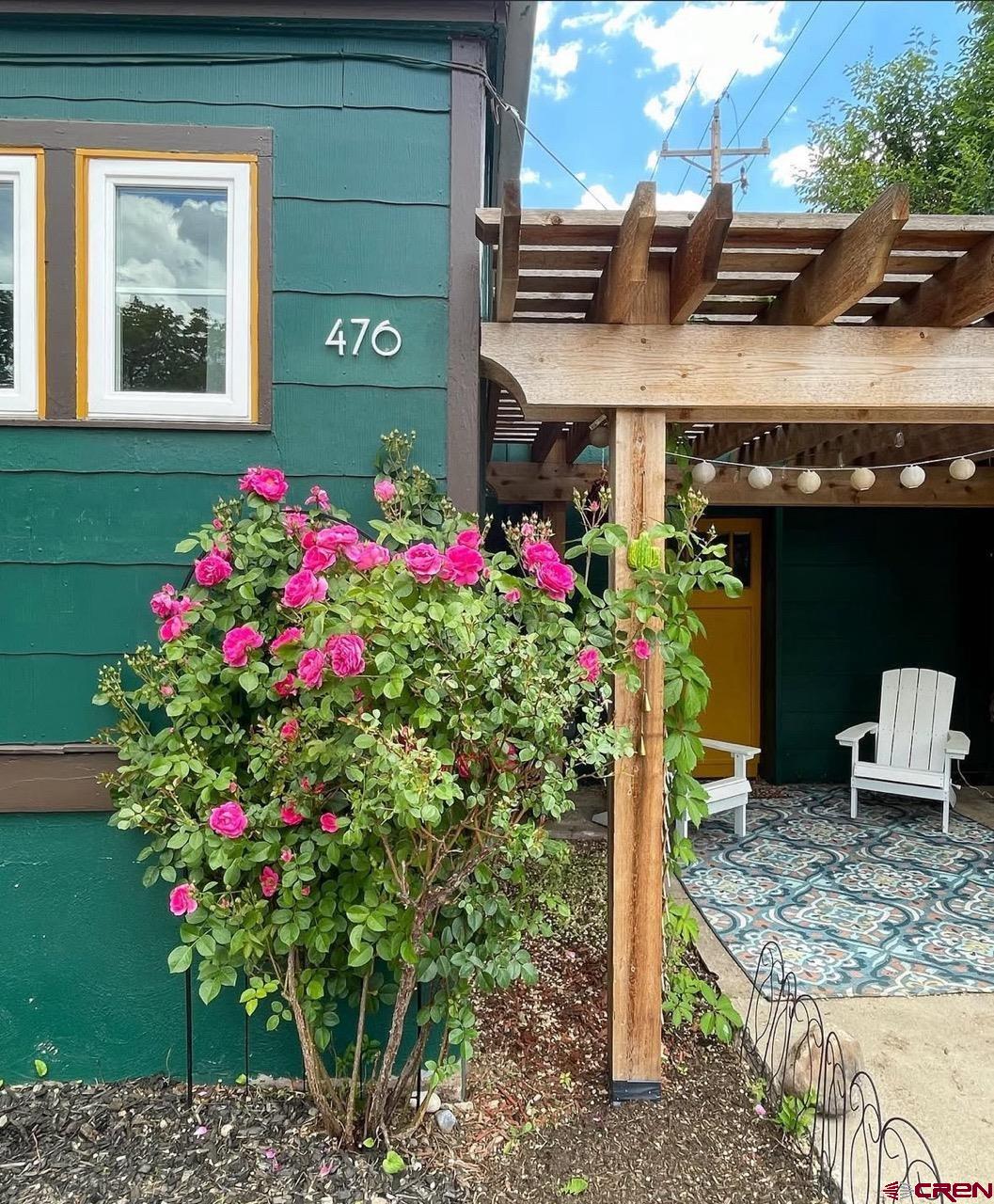 476 East 5th Street Durango, CO 81301 - Photo 24 of 40 a front view of a house with a yard and fountain