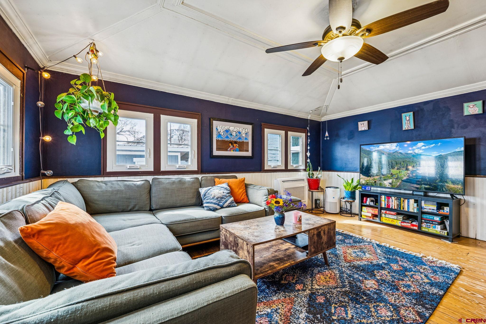 476 East 5th Street Durango, CO 81301 - Photo 5 of 40 a living room with furniture and a flat screen tv