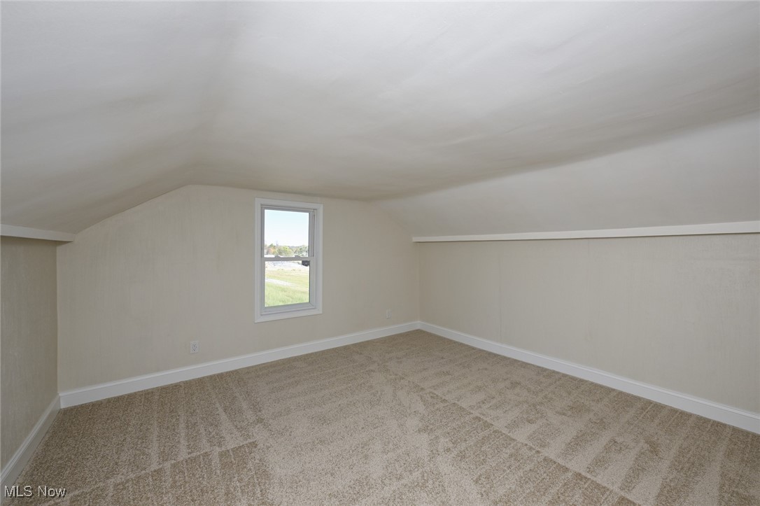 14328 Calaboone Road Doylestown, OH 44230 - Photo 25 of 45 Bedroom with lofted ceiling and light carpet