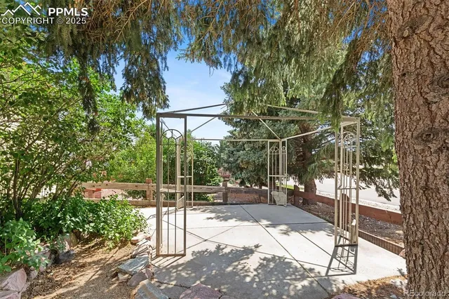 a view of yard with patio