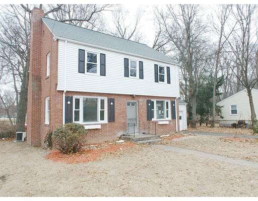 603 Allen Street Springfield, MA 01118 - Photo 1 of 12 a front view of a house with a yard