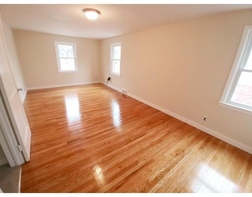 603 Allen Street Springfield, MA 01118 - Photo 12 of 12 an empty room with wooden floor and windows