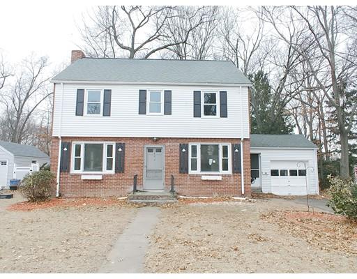 603 Allen Street Springfield, MA 01118 - Photo 2 of 12 a front view of a house with a yard covered in snow