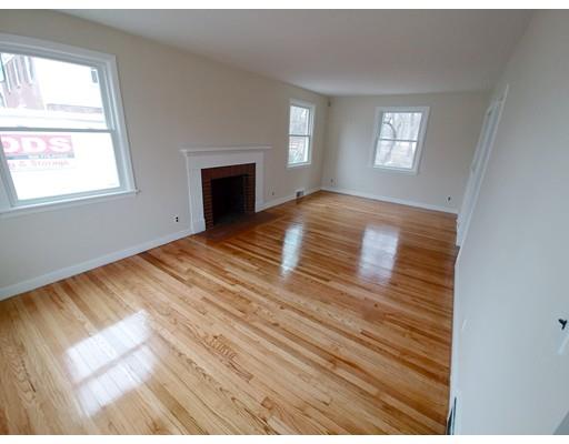 603 Allen Street Springfield, MA 01118 - Photo 6 of 12 a view of empty room with window and fireplace