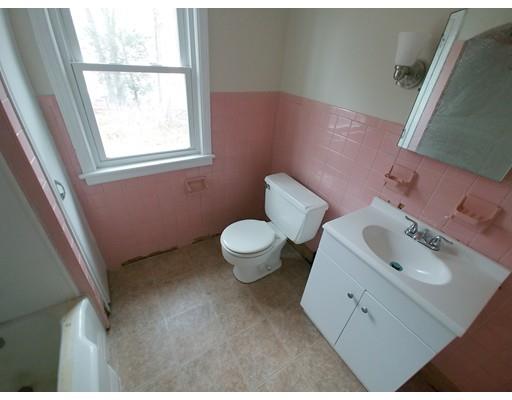 603 Allen Street Springfield, MA 01118 - Photo 8 of 12 a bathroom with a sink toilet and a window