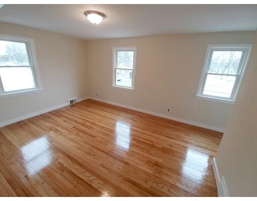 603 Allen Street Springfield, MA 01118 - Photo 10 of 12 a view of empty room with wooden floor and fan