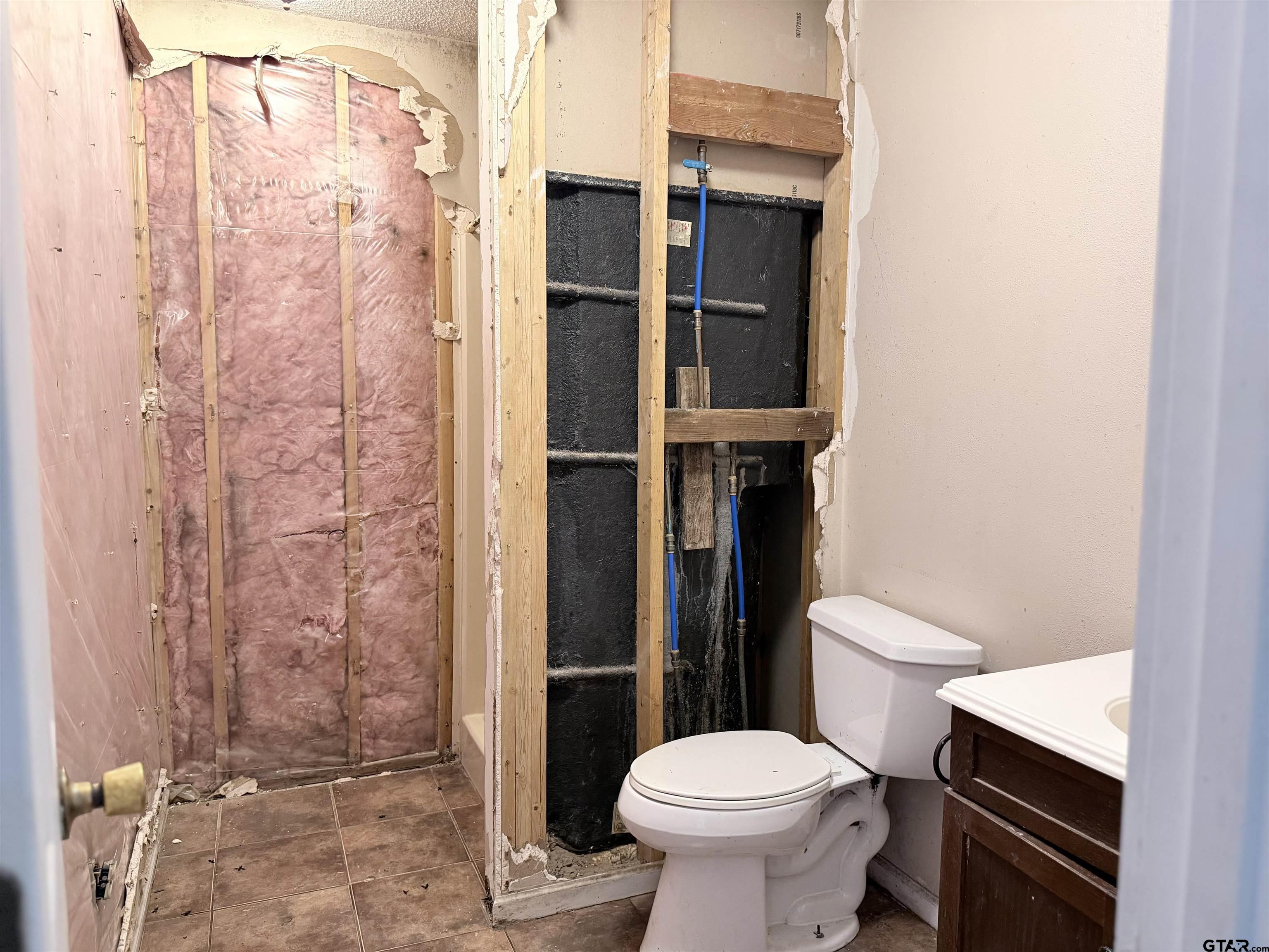 14946 County Road 220 Tyler, TX 75707 - Photo 17 of 41 a bathroom with a toilet and a shower