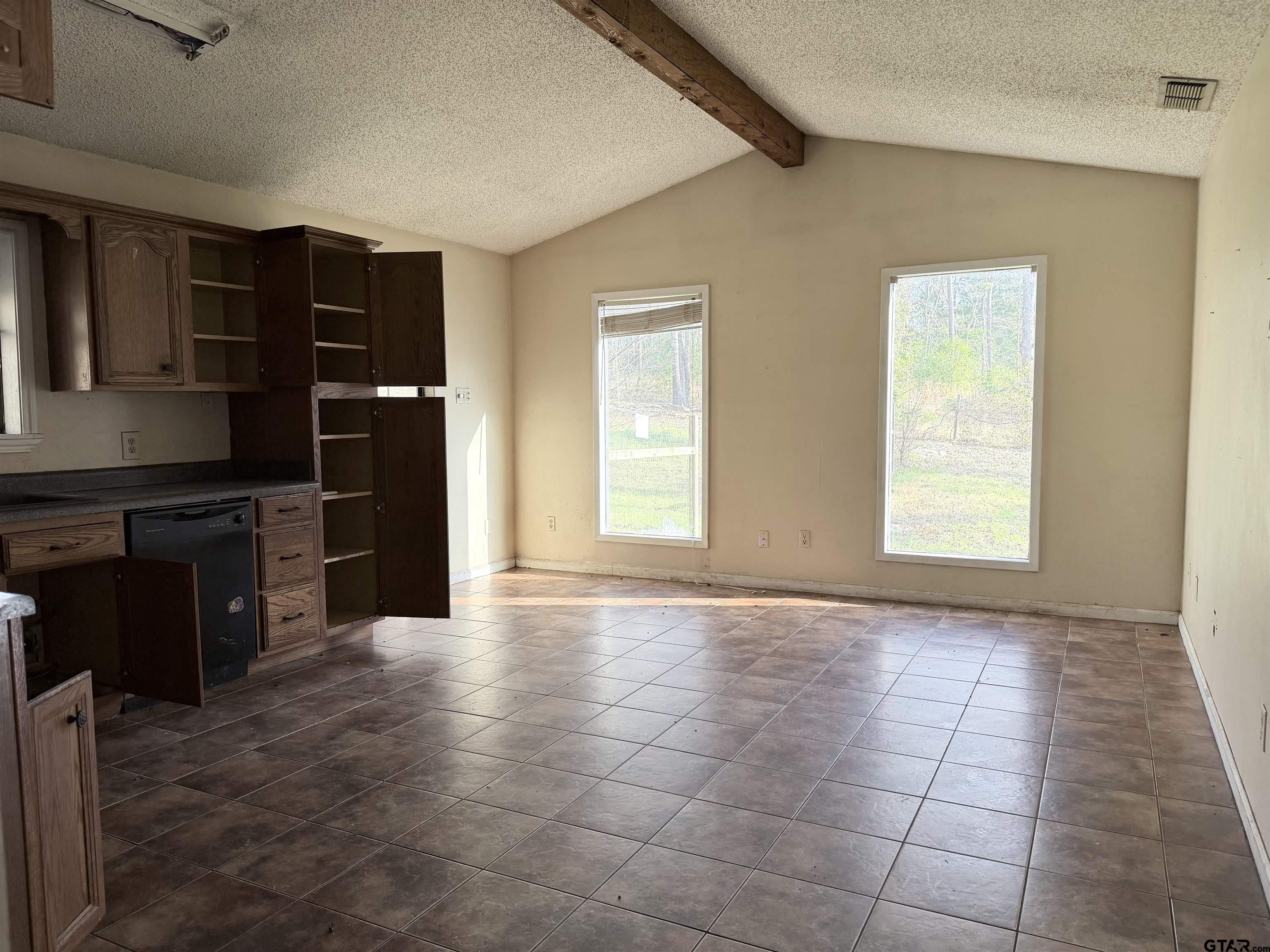 14946 County Road 220 Tyler, TX 75707 - Photo 18 of 41 a view of an empty room with a kitchen