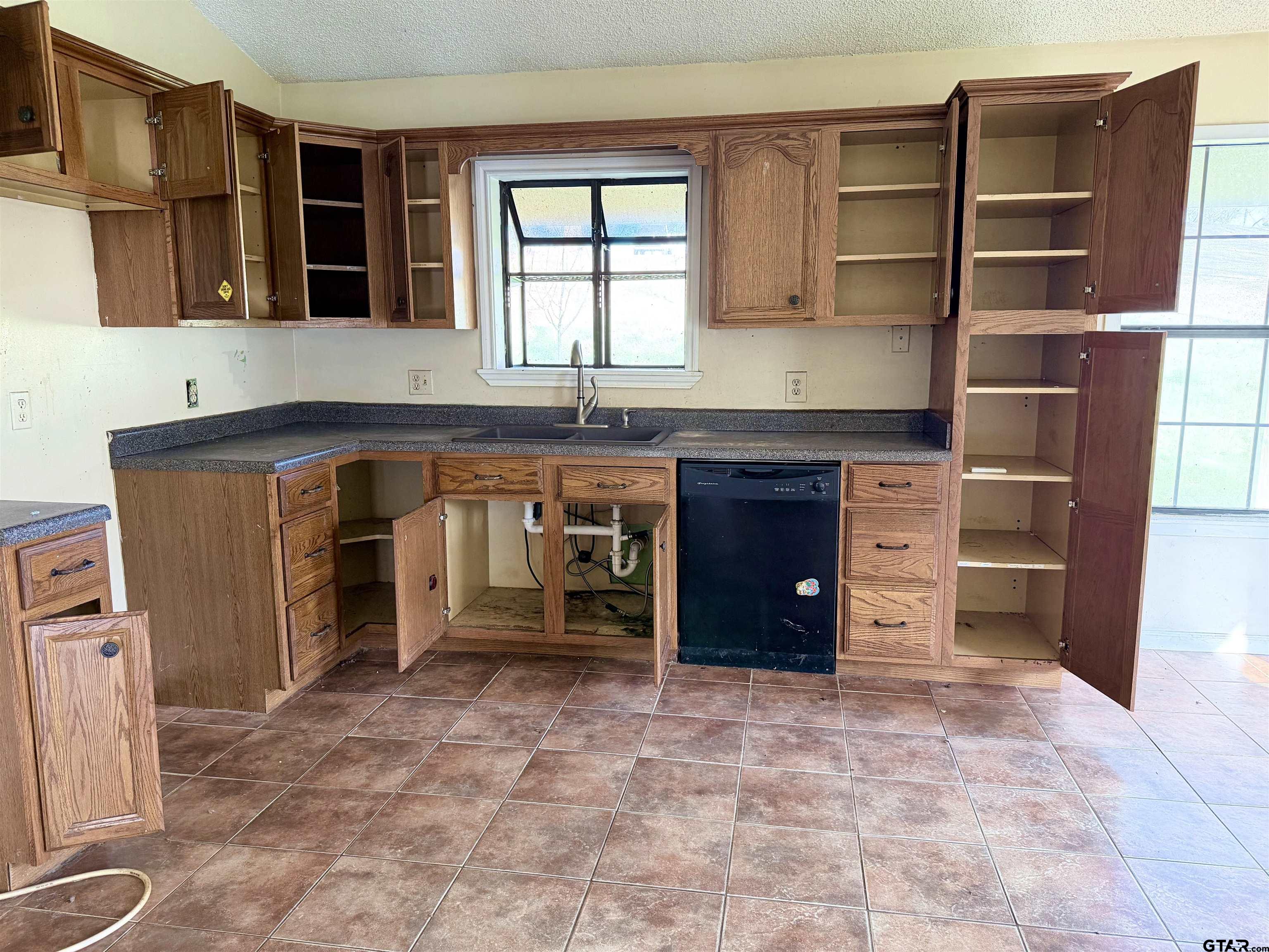 14946 County Road 220 Tyler, TX 75707 - Photo 20 of 41 a kitchen with a cabinets and window