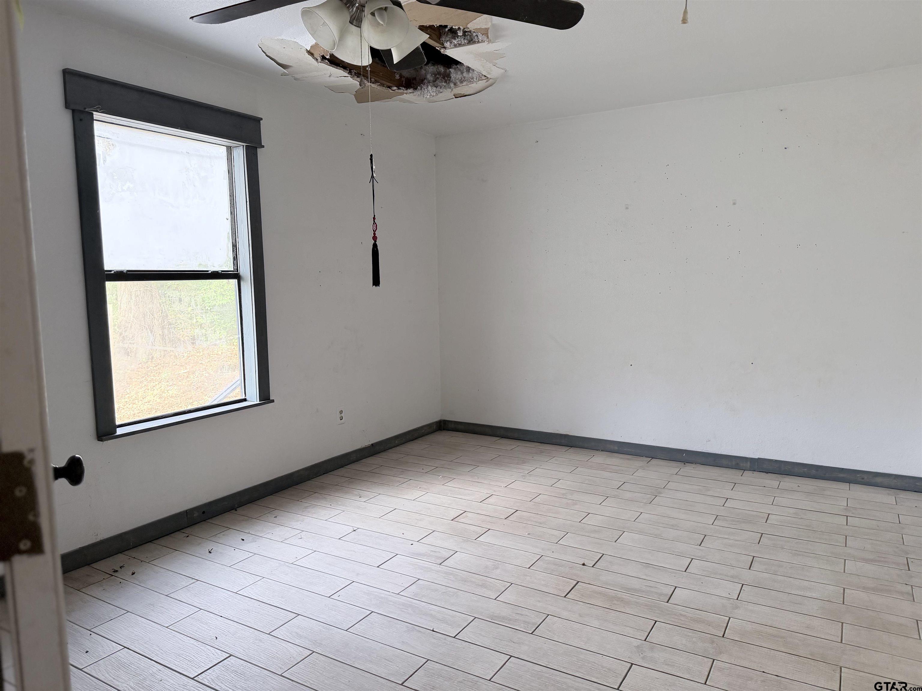 14946 County Road 220 Tyler, TX 75707 - Photo 6 of 41 a view of an empty room with a window