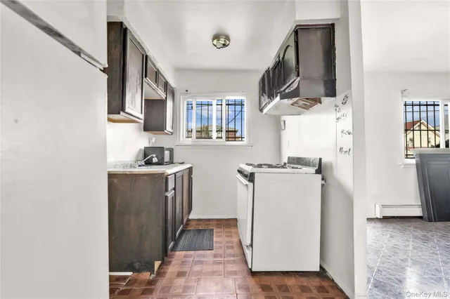 a kitchen with a refrigerator a stove top oven a sink and dishwasher