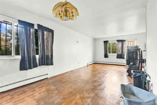 a view of an entryway with wooden floor