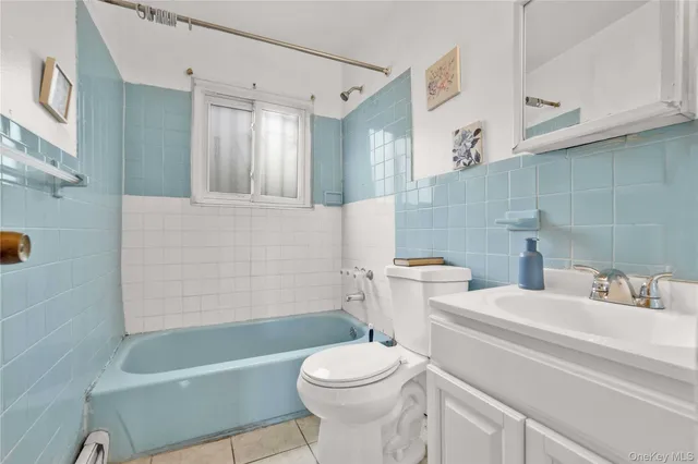 a bathroom with a sink a toilet and a bathtub