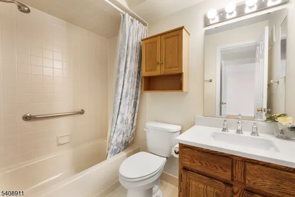 a view of an empty room and bathroom