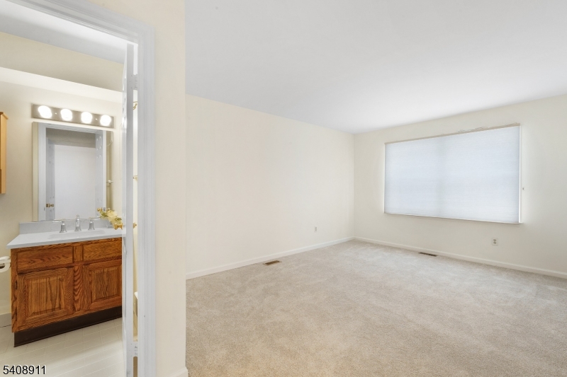 109 Alexandria Way Bernards, NJ 07920 - Photo 14 of 16 a view of an empty room and bathroom