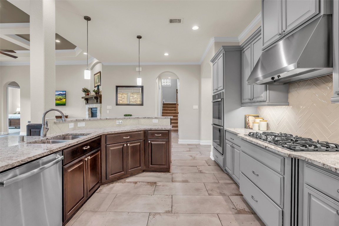4060 Windsor Chase Drive Spring, TX 77386 - Photo 15 of 40 a large kitchen with stainless steel appliances granite countertop a stove and a sink