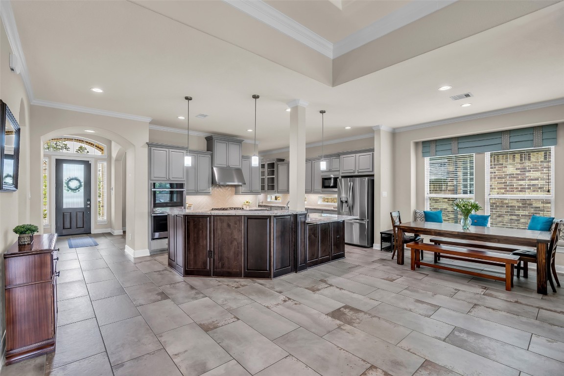 4060 Windsor Chase Drive Spring, TX 77386 - Photo 17 of 40 a large kitchen with a large counter top and stainless steel appliances