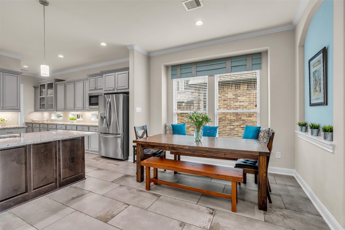 4060 Windsor Chase Drive Spring, TX 77386 - Photo 18 of 40 a kitchen with refrigerator and windows