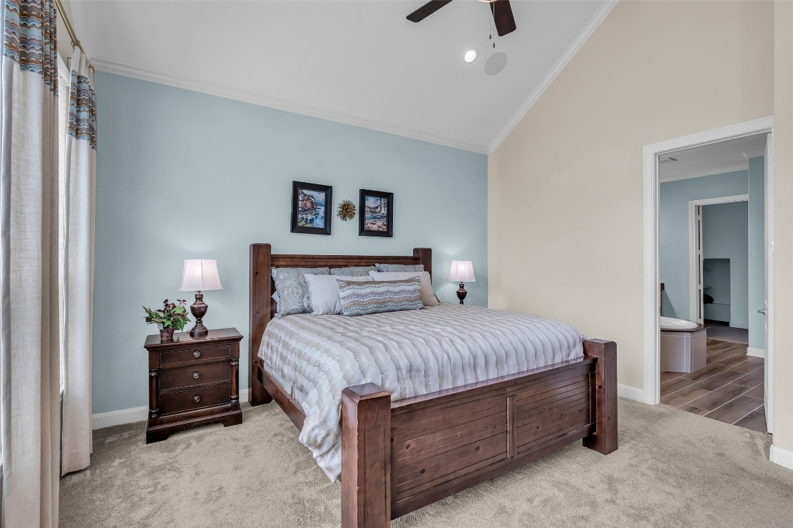 4060 Windsor Chase Drive Spring, TX 77386 - Photo 22 of 40 a bedroom with a bed and a chandelier