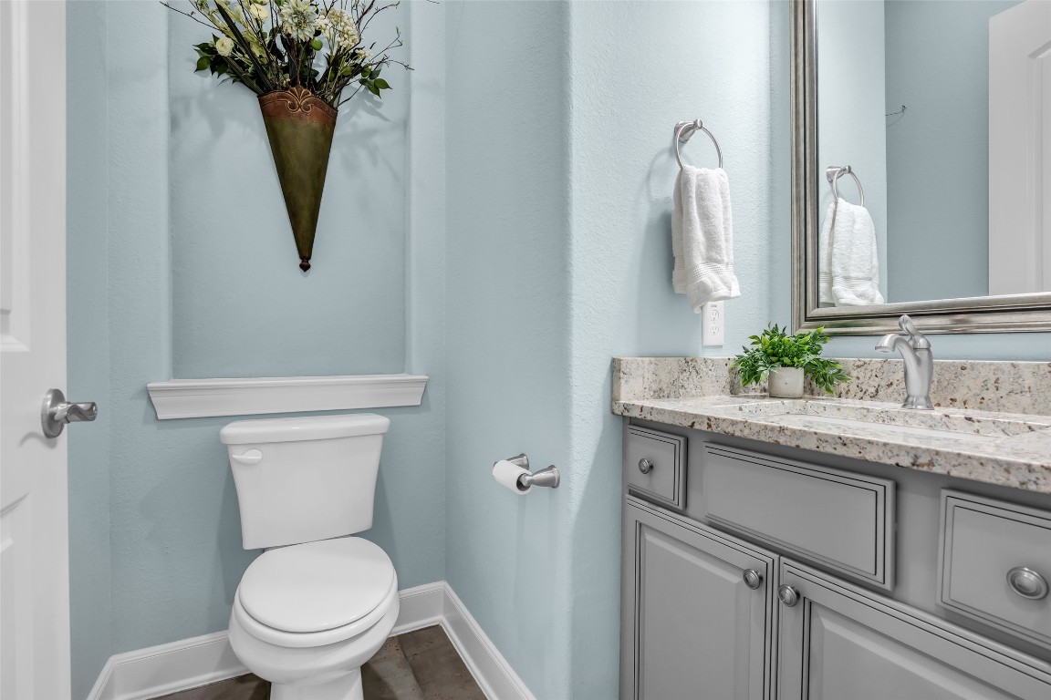 4060 Windsor Chase Drive Spring, TX 77386 - Photo 26 of 40 a bathroom with a toilet sink and mirror