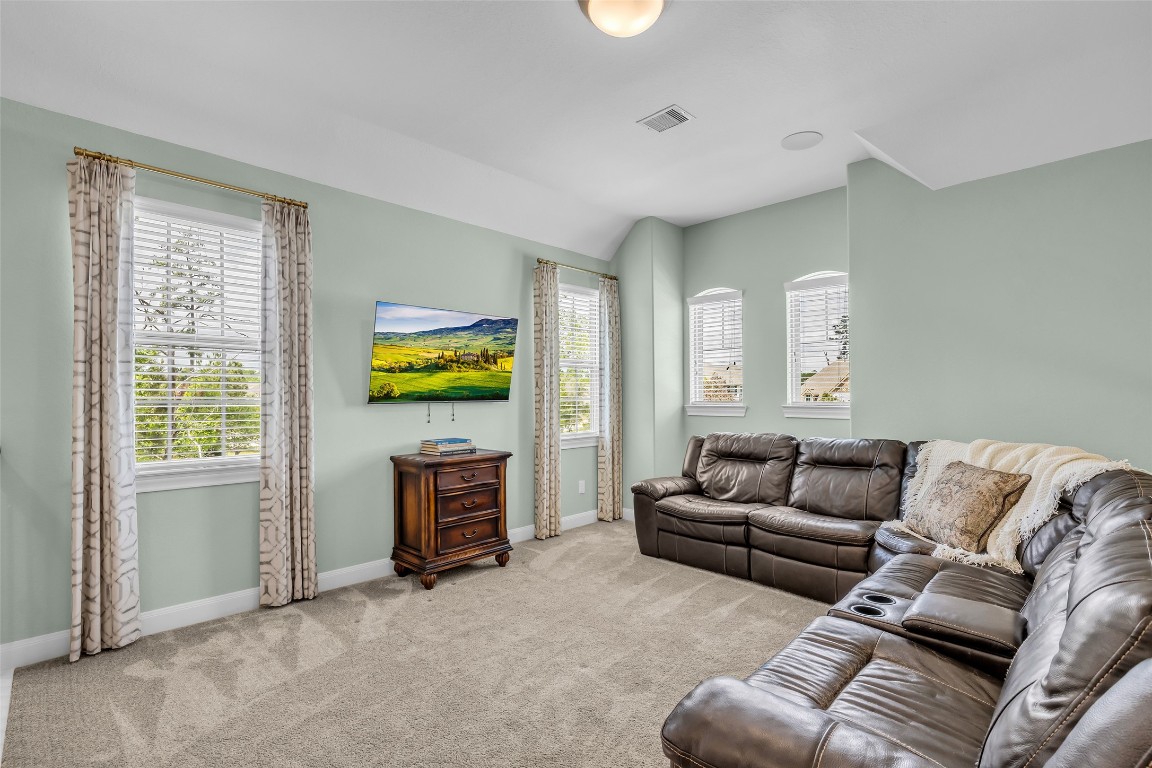 4060 Windsor Chase Drive Spring, TX 77386 - Photo 28 of 40 a living room with furniture and a flat screen tv