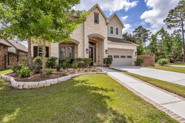 a front view of house with yard and outdoor seating